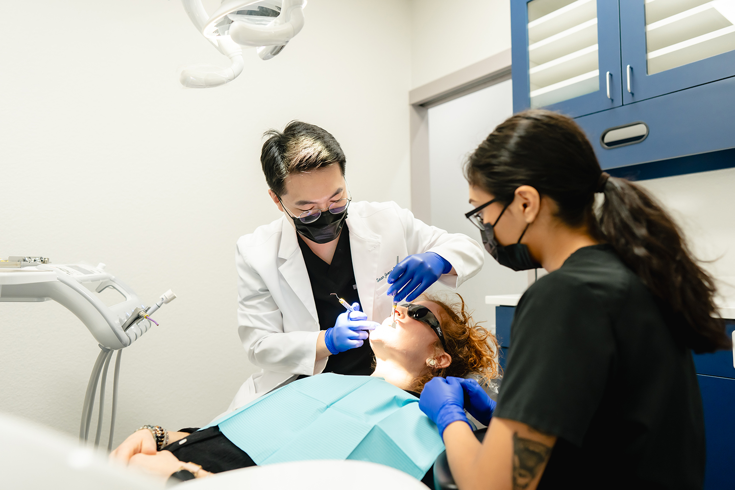 dentists examining patient